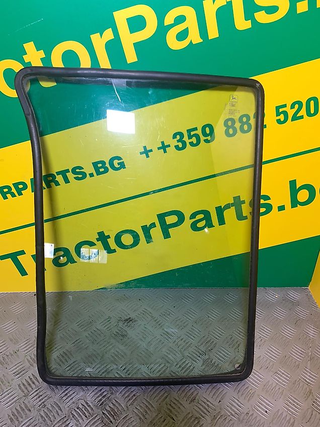 John Deere LOWER FRONT GLASS LEFT - CURVED - TINTED (used) - John Deere 6000, 6010